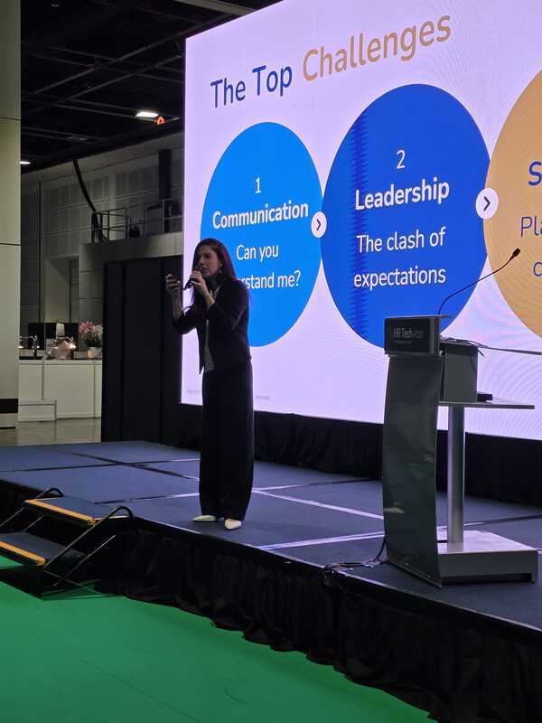 Meital Baruch presenting at a corporate event